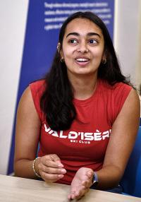 Young woman wearing a red shirt jestures